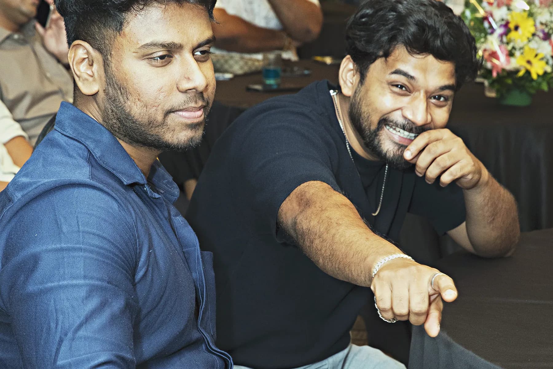 Guests reacting to an announcement from the floor at the HiBizz launch event in Goa