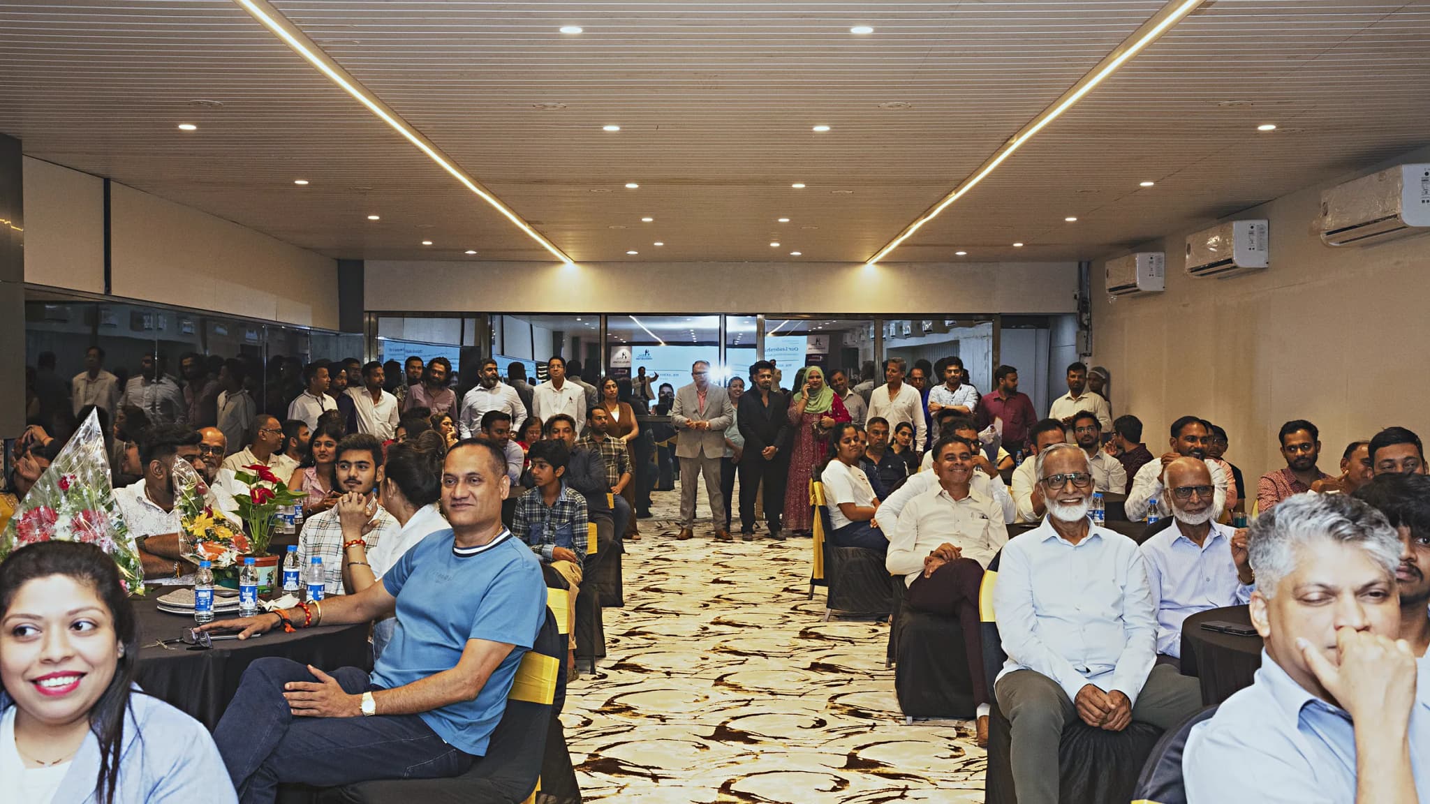 Guests seated across the full HiBizz business event hall in Colvale, Goa during a corporate launch