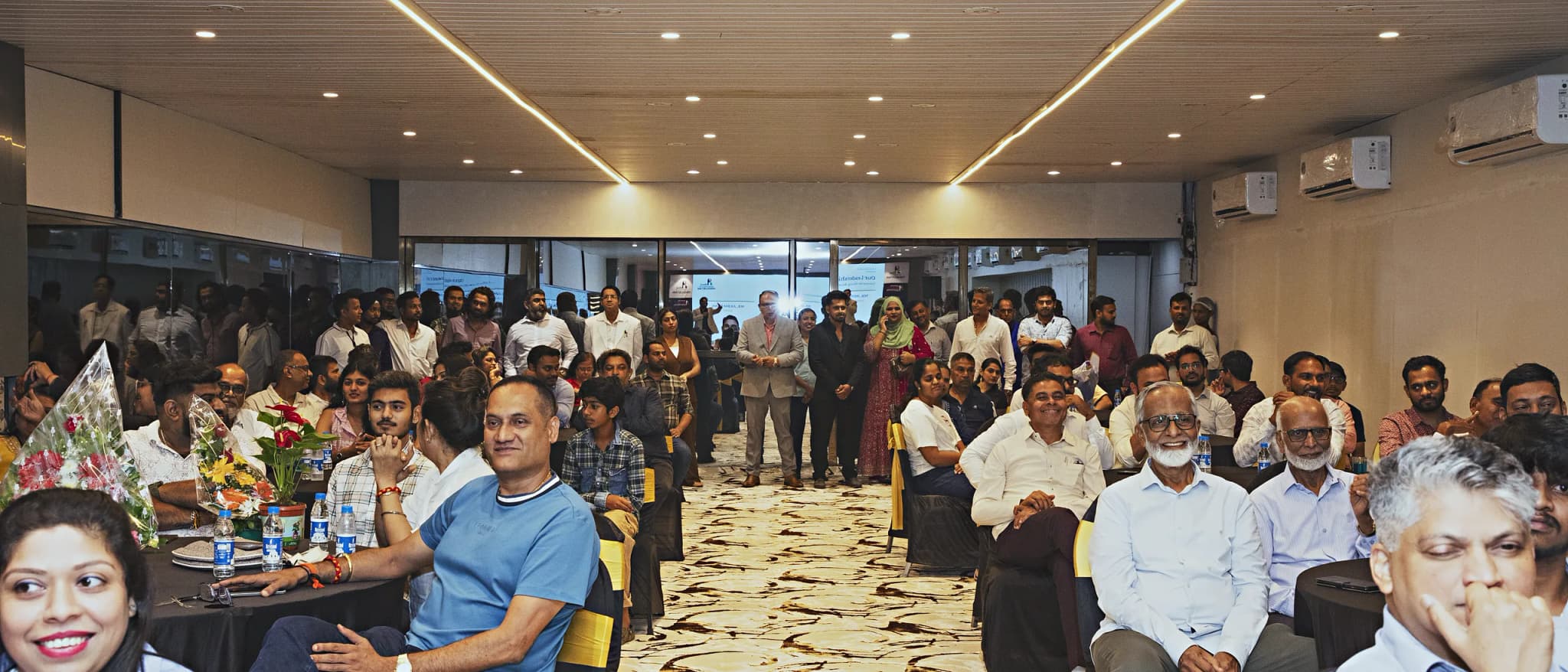 Wide view of the HiBizz conference hall in Goa filled with seated delegates