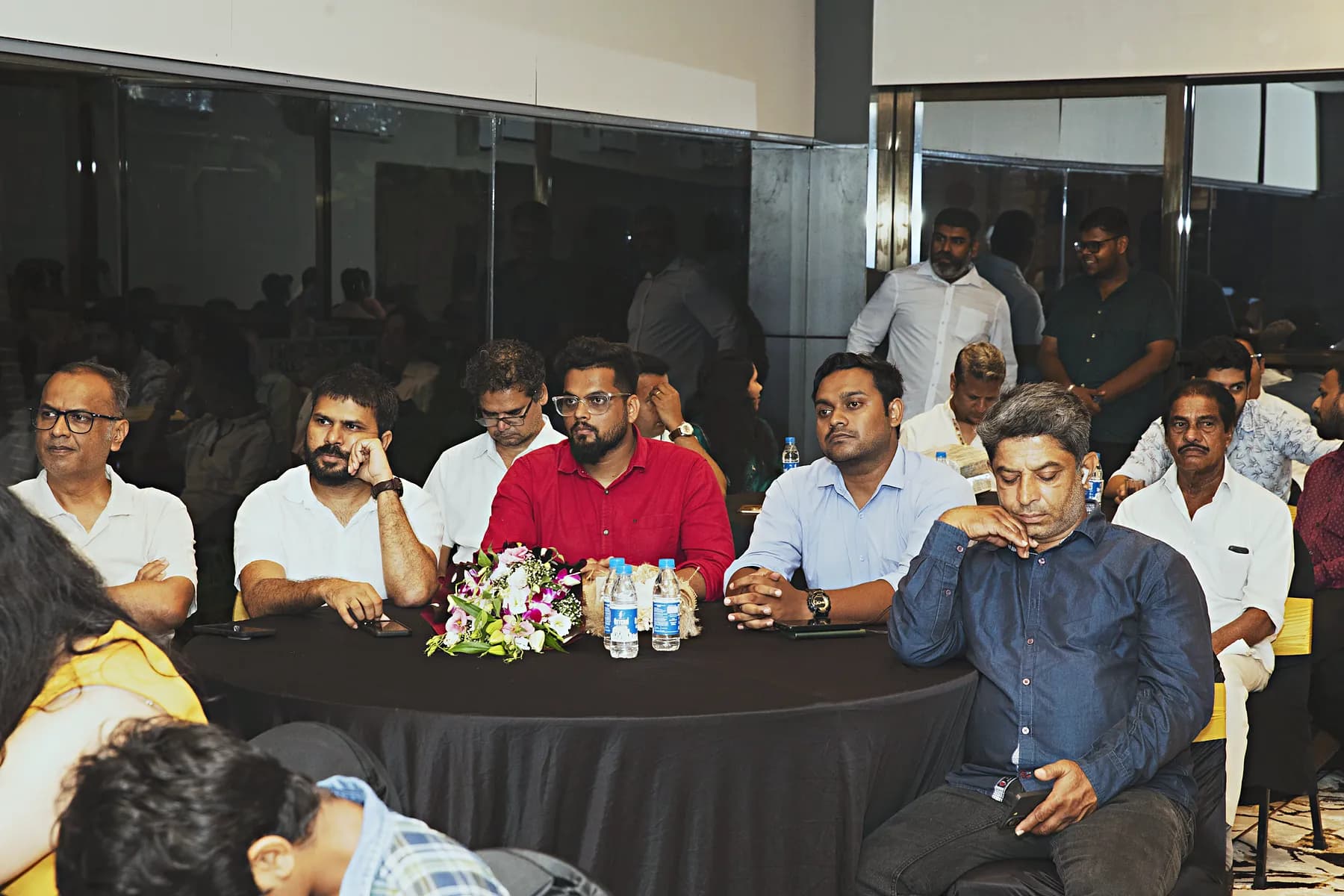 Guests talking around banquet tables during the HiBizz launch evening in Goa