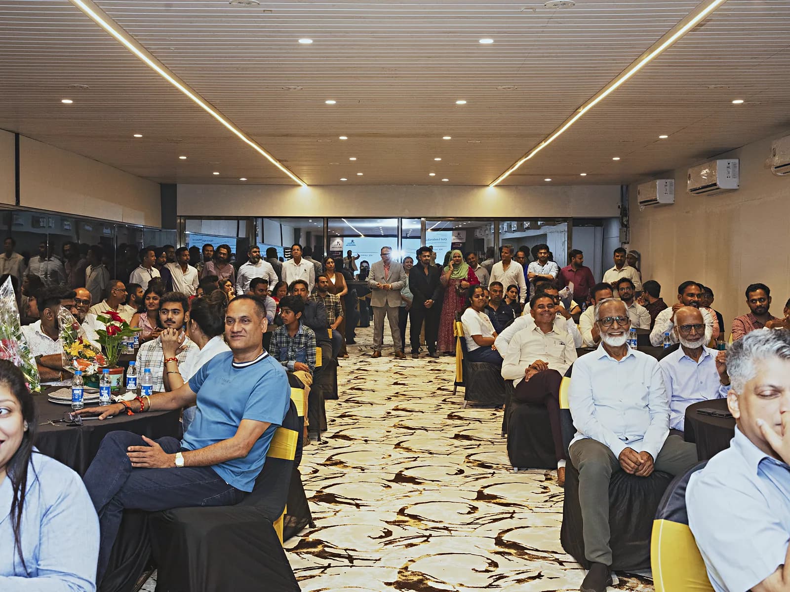 Full length of the HiBizz banquet hall in Goa with delegates seated at round tables